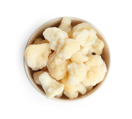 Frozen cauliflower florets in bowl isolated on white, top view. Vegetable preservation