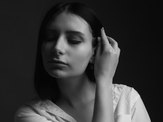 Black and white portrait of young beautiful lady. Studio