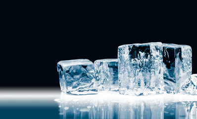 Crystal clear transparent blue shiny ice cubes, isolated on black background.