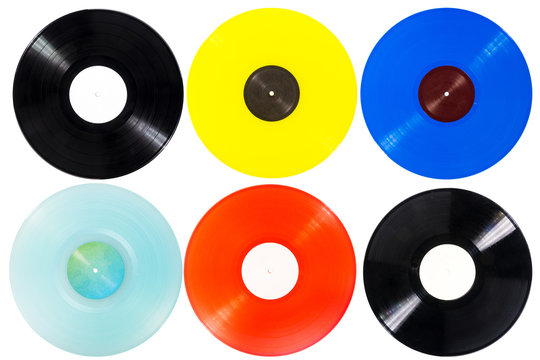 Collection of various color vinyl records isolated on white background