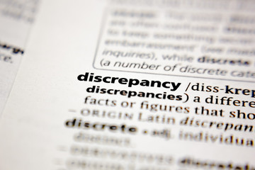 Word or phrase discrepancy in a dictionary.
