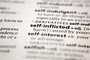 Word or phrase self-inflicted in a dictionary.