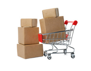 Shopping cart and boxes isolated on white. Logistics and wholesale concept