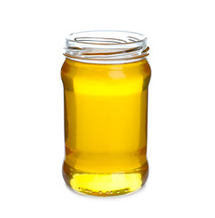 Jar of organic honey isolated on white