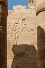 Karnak Temple Complex in Luxor, Egypt. An ancient bas-relief with hieroglyphics on the wall,...