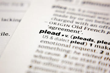 Fototapeta premium Word or phrase plead in a dictionary.