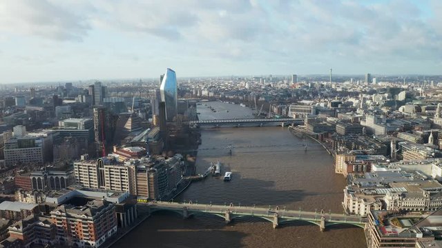 London city centre aerial panorama view: financial district, Thames river, Belfast, skyscrappers, warf and buildings and St. Pauls Cathedral, Tower Bridge and The Tower