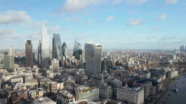 London city centre aerial panorama view: financial district, Thames river, Belfast, skyscrappers, warf and buildings and St. Pauls Cathedral, Tower Bridge and The Tower