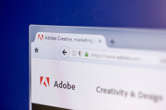 Ryazan, Russia - March 01, 2018 - Homepage of Adobe on a display of PC, web adress - adobe.com