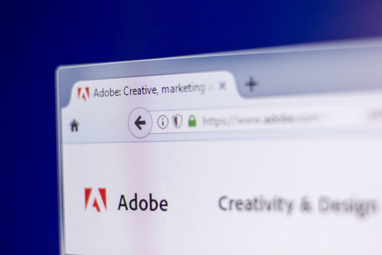 Ryazan, Russia - March 01, 2018 - Homepage of Adobe on a display of PC, web adress - adobe.com