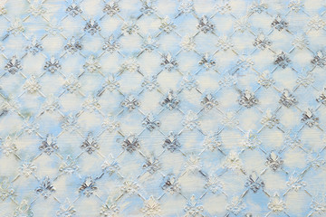 background of blue wooden vintage wall with floral Royal lily emboss details