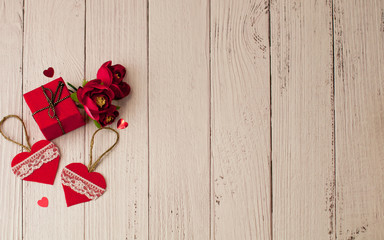 Holiday background for Valentine's day on a white wooden background in retro style with gifts.