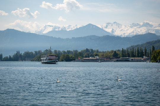 Beautiful scene of Lake Lucerne with farry boat on mountain and sky background, copy space, Switzerland