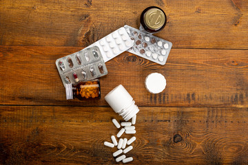 Pills white, blister pack and different medicine bottles