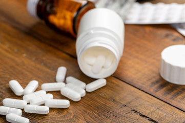 Pills white, blister pack and different medicine bottles