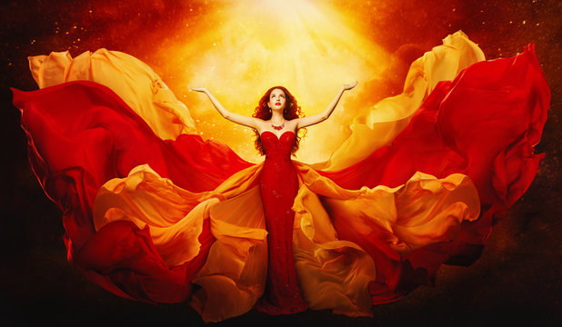 Woman in Flying Dress Raised Arms to Mystery Light, Fantasy Goddess in Red Fluttering Gown