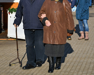 Senior couple walks on the city street