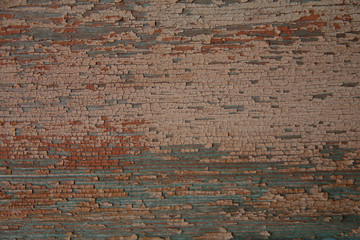 background texture of old natural wooden boards with old multicolor paint with scuffs. Vintage background, pattern, banner.