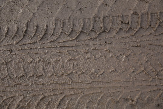tire tracks in the dirt of the road, tire tread. Background, texture, pattern, banner.