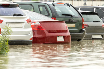Cars stuck in water in a flooded parking lot after heavy in rain in Dubai