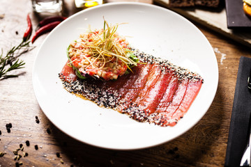 Tuna sashimi served on a plate in restaurant