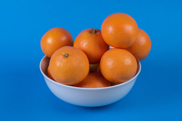 group of oranges with blue background