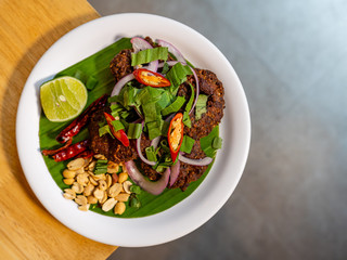 Spicy deep fried minced pork with roasted beans lime and dried chilli