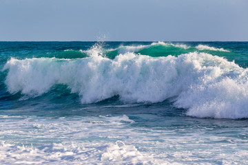 Ocean wave curve forming at the stormy weather day. Storm at the sea background.