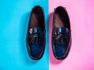 Men fashion leather Loafer shoe on blue and pink background. Top view
