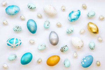 Top view spring holidays Easter Full background made of colorful, pastel, handmade painted Easter eggs on a white