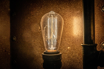 Beautiful retro luxury bulb lighting lamp steel background. Copy Space