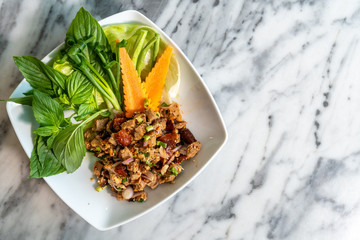 Duck larb with crispy duck skin