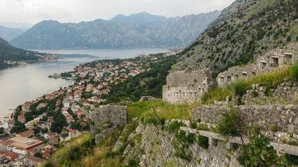 Fototapeta na wymiar walls of Castle Of San Giovanni in Kotor city and panoramic view of old town