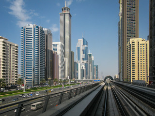 Fototapeta na wymiar modern skyscrapers along the metro line in Dubai, UAE