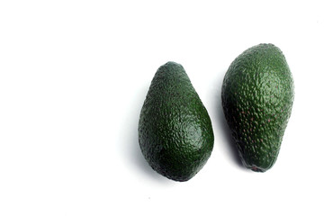 two avocado isolated on white background. Horizontal image. Flat lay