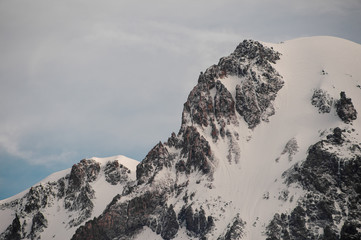 Fototapeta na wymiar Close view at mountain covered in snow
