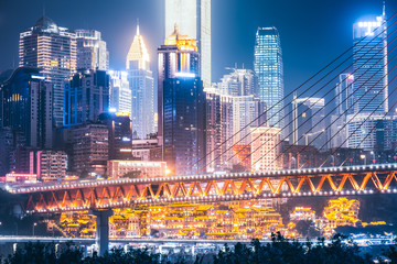 chongqing city at night with bridge and skyscrapers