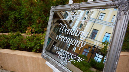 Wedding Ceremony Sign On Mirror and Decoration