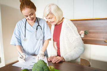 Positive delighted medical worker showing necessary prescription