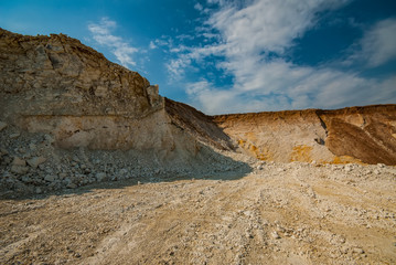Marl quarry for the extraction of raw materials for the production of cement. Industrial landscape.