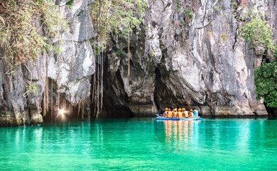 Cave entrance of Puerto Princesa subterranean underground river with longtail boat - Wanderlust...