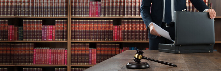 Lawyer Putting Documents In Briefcase