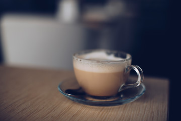 cup of coffee on wooden table
