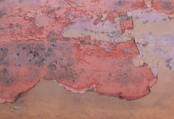 Rusted metal wall. Rusty metal background with streaks of rust.stain.