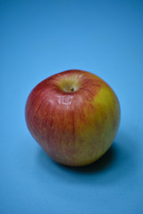 Fresh apple on blue background