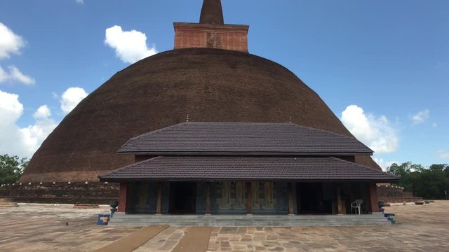 Anuradhapura, Sri Lanka, large dome against the sky with clouds 4K