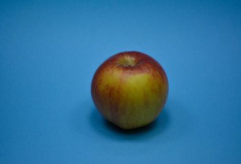 Fresh apple on blue background
