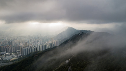 The mist covering the mountain next to the city