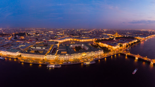 Beautiful aerial evning view in the white summer nights of St Petersburg, Russia, Hermitage at sunset, palace square, St. Isaac's Cathedral, The Alexander column, River Neva. shot from drone. Europe.