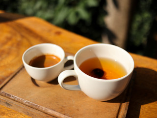 cup of coffee on wooden table. Bael Fruit Juice